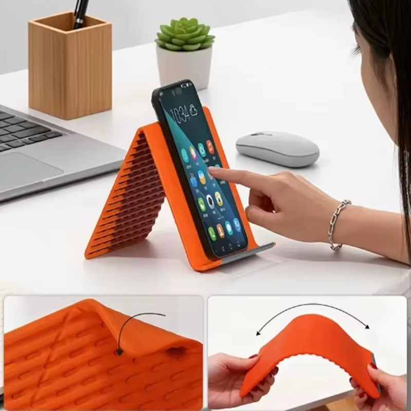 Laptop Stand - 角度調整可能で、柔軟性があり、折りたたみ式のシリコン製スマートフォンホルダー。ノートパソコンやタブレット用のポータブルデスクトップスタンドとして、ご家庭やオフィスでご使用いただけます。